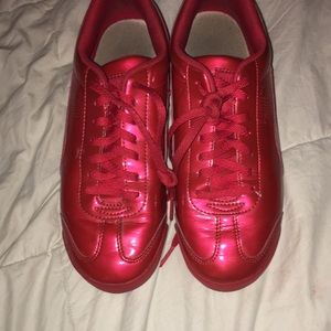 Shiny red pumas, size 6 mens//8 in womens